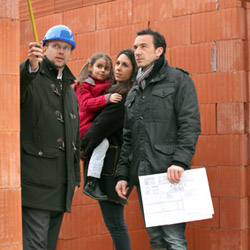 Family having their new home inspected by an engineer