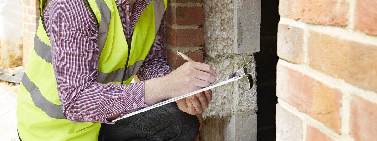 Home Inspector Checking House